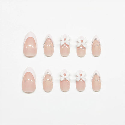 24Pcs Almond Shaped Artificial Nails - French Tips with Cute Bow Charms Design - Nude Pink Acrylic Nails for Women & Girls